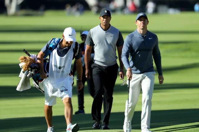 Tiger Woods and Rory McIlroy walk across the 17th hole at Riviera Country Club. Picture: Warren Little/Getty Images