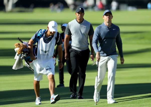 Tiger Woods and Rory McIlroy walk across the 17th hole at Riviera Country Club. Picture: Warren Little/Getty Images