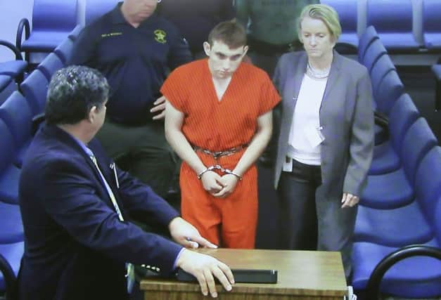 High school shooting suspect Nikolas Cruz appears in court with his lawyer Melisa McNeill in Fort Lauderdale, Florida. Picture: AFP/Getty