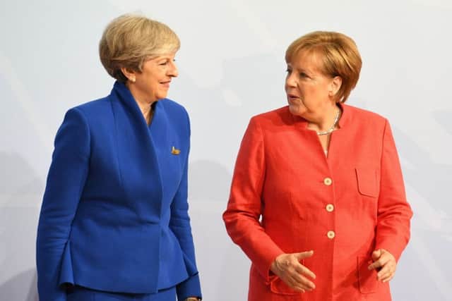 Theresa May and German Chancellor Angela Merkel, who will hold talks amid growing impatience among EU leaders at the UK's reluctance to spell out its goals in the Brexit negotiations. Picture; PA