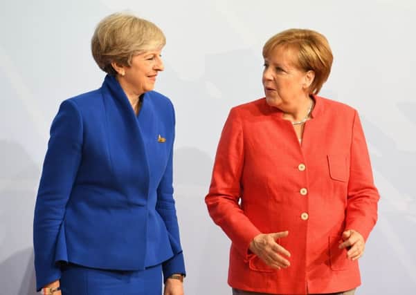 Theresa May and German Chancellor Angela Merkel, who will hold talks amid growing impatience among EU leaders at the UK's reluctance to spell out its goals in the Brexit negotiations. Picture; PA