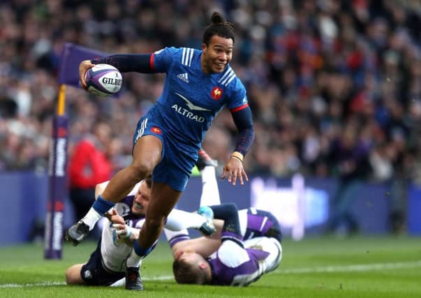 Teddy Thomas breaks through to score France's first try during the Six Nations match between Scotland and France. Picture: Getty Images