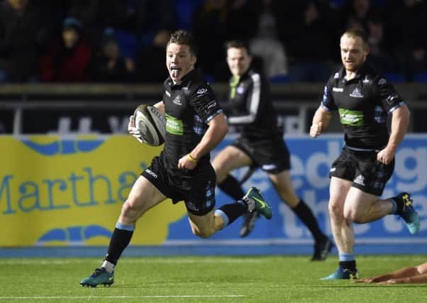 Glasgow Warriors' George Horne breaks through to score his try at Scotstoun. Picture: SNS Group