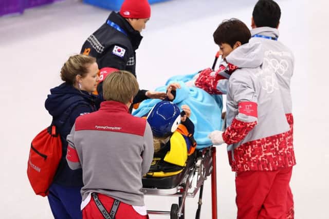 Elise Christie being carted off on a stretcher. Picture: Getty