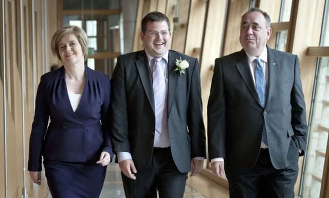 Mark McDonald, pictured with Nicola Sturgeon and Alex Salmond in 2013, has failed to attend parliament since his resignation as a junior minister in November. Photograph: Universal News And Sport