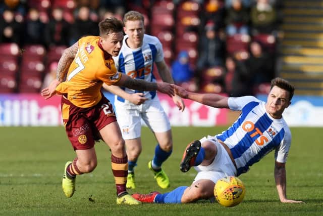 Motherwell's Craig Tanner is challenged by Eamonn Brophy. Picture: SNS/Craig Foy