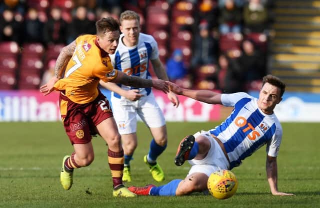 Motherwell's Craig Tanner is challenged by Eamonn Brophy. Picture: SNS/Craig Foy