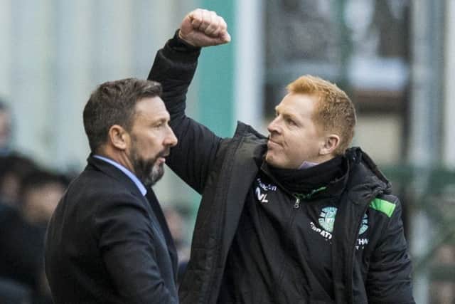 Neil Lennon celebrates as a despondent Derek McInnes watches on. Picture: SNS
