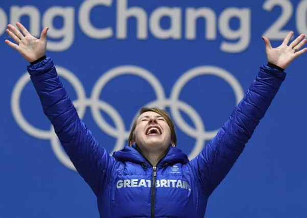 Lizzy Yarnold celebrates on the podium during yesterdays medal ceremony. Picture: AFP/Getty
