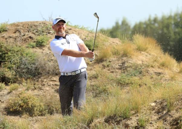 Stephen Gallacher plays his second shot at the first in the final round of the NBO Oman Open at Al Mouj Golf in Muscat. Picture: Getty Images