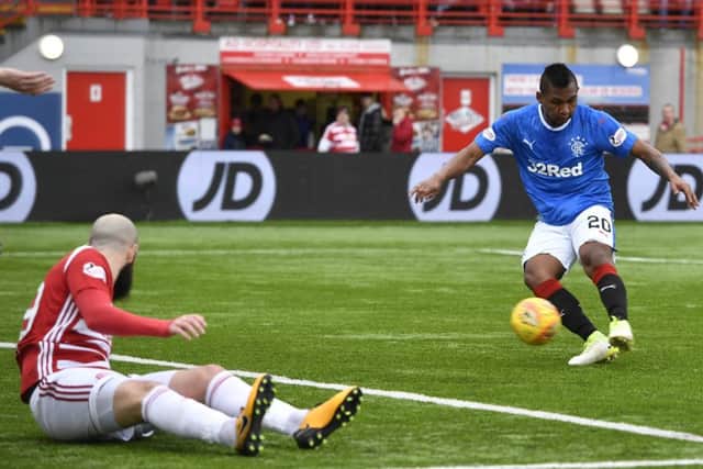 Alfredo Morelos fires Rangers in front at 3-2 as Georgios Sarris watches on. Picture: SNS