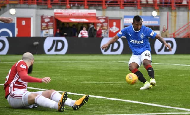 Alfredo Morelos fires Rangers in front at 3-2 as Georgios Sarris watches on. Picture: SNS