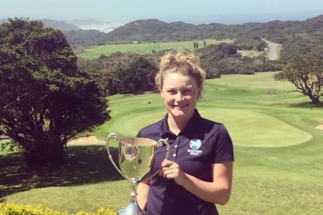 Aboyne's Shannon McWilliam shows off the trophy after her win at East London