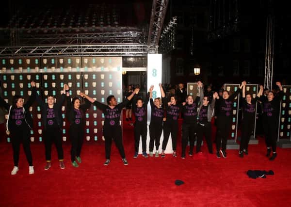 Time's Up campaigners storm the red carpet wearing tops reading 'Times Up Theresa' at the EE British Academy Film Awards held at the Royal Albert Hall. Picture: Yui Mok/PA Wire.