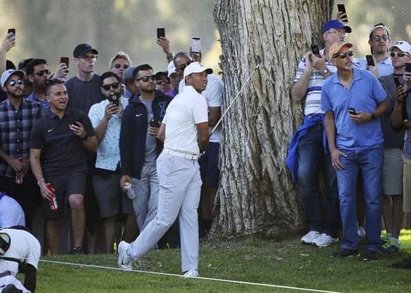 uge crowds followed Tiger Woods when he was paired with Rory McIlroy and Justin Thomas in the Genesis Open. Picture: AP