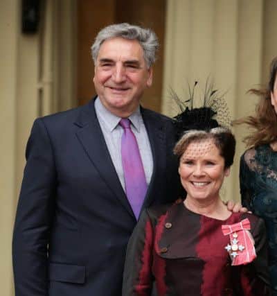 Staunton with husband Jim Carter after receiving her CBE in 2016. (Photo by Yui Mok - WPA Pool / Getty Images)