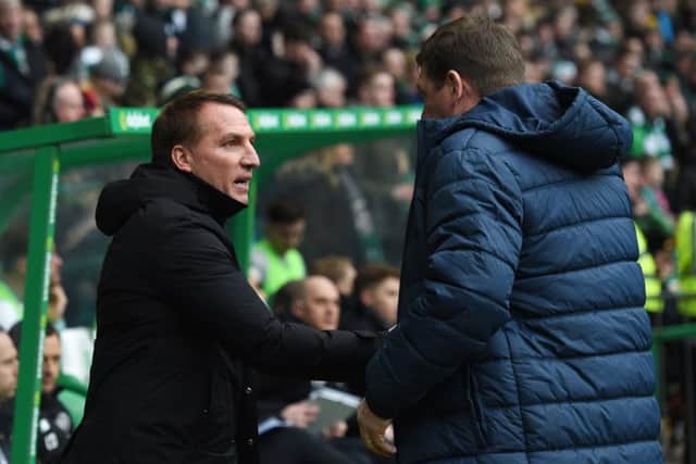 St Johnstone manager Tommy Wright (right) shakes hands with Brendan Rodgers. Picture: SNS