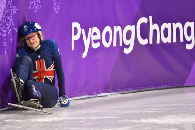 Elise Christie falls during her 1,000m short track speed skating heat. Picture: AFP/Getty