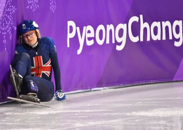 Elise Christie falls during her 1,000m short track speed skating heat. Picture: AFP/Getty