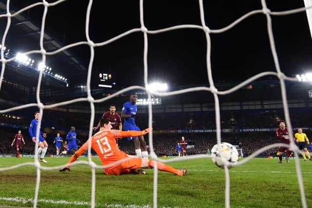 Lionel Messi watches his shot hit the Chelsea net as he scores Barcelonas equaliser at Stamford Bridge. Picture: Getty.