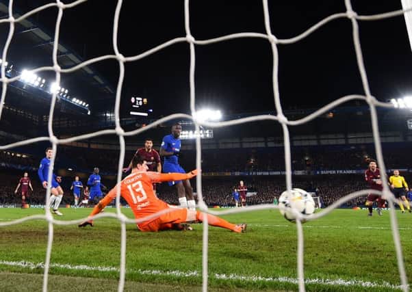 Lionel Messi watches his shot hit the Chelsea net as he scores Barcelonas equaliser at Stamford Bridge. Picture: Getty.