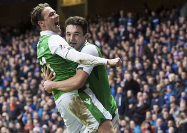 Scott Allan, left, celebrates with John McGinn after the latter opens the scoring at Ibrox. Picture: SNS