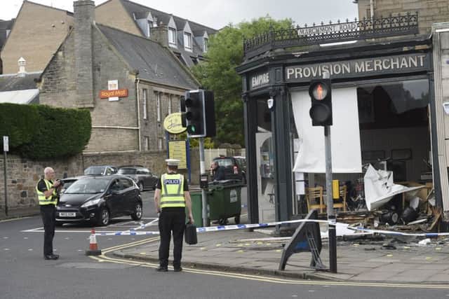Pic Greg Macvean - 07/07/2015 - Empire Cafe on the corner of Marchmont Road and Strathearn Road where a car mounted the pavement crashing into the cafe and hitting a man on the street at the same time before driving off.  Blood from the pedestrian is seen on the ground by broken glass.