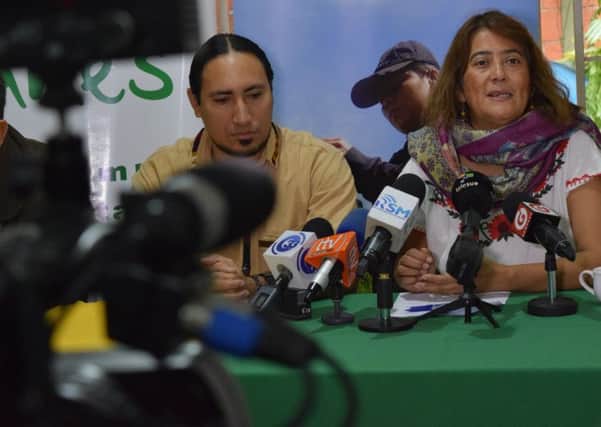 Mauricio SermeÃ±o, Luis GonzÃ¡lez and Carolina Amaya at a UNES press conference in El Salvador.