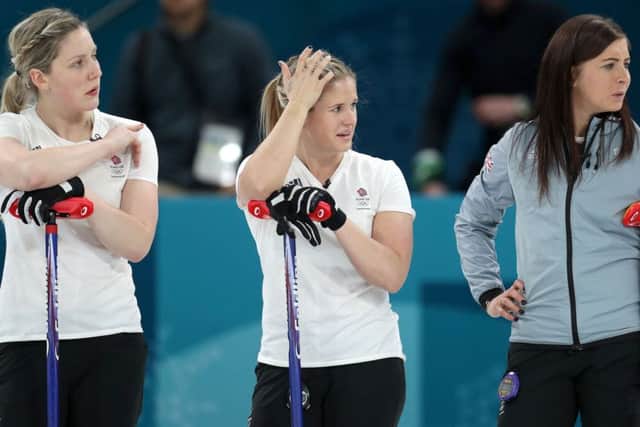 The pain of defeat shows in the faces of Lauren Gray, left, Vicki Adams and GB skip Eve Muirhead following their defeat by Sweden. Picture: PA.