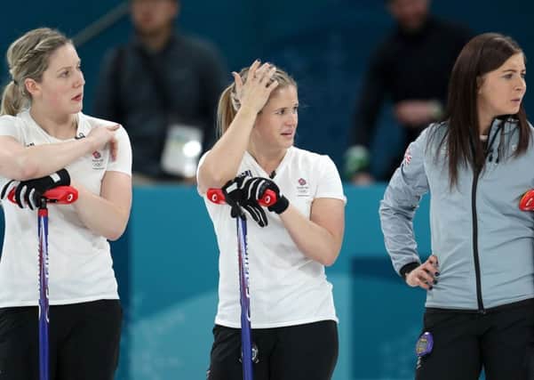 The pain of defeat shows in the faces of Lauren Gray, left, Vicki Adams and GB skip Eve Muirhead following their defeat by Sweden. Picture: PA.