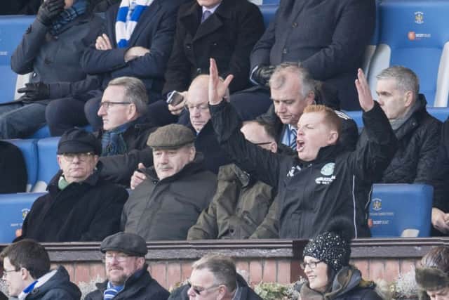 An animated Lennon next to Rod Petrie in the stands. Picture: SNS Group