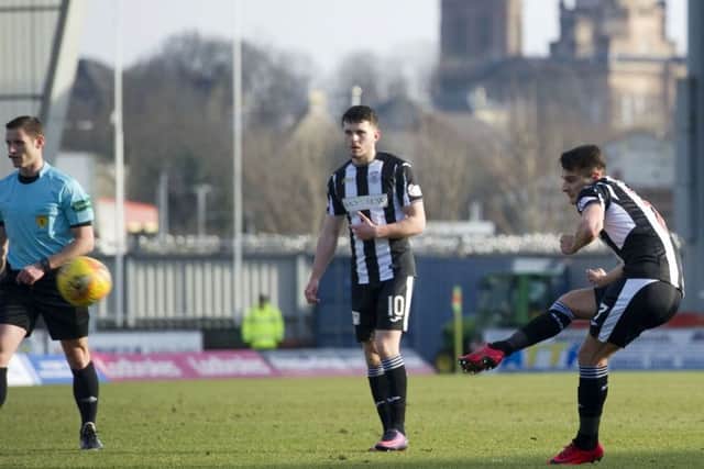 St Mirren's Kyle Magennis' shot is deflected in to the net by Brechin goalkeeper Patrick O'Neil to make it 1-0. Picture: Garry Williamson