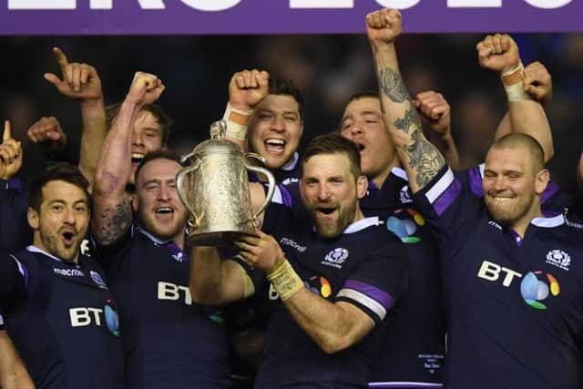 John Barclay holds aloft the Calcutta Cup and leads the celebrations with the team after Scotland's victory over England. Picture: Getty Images