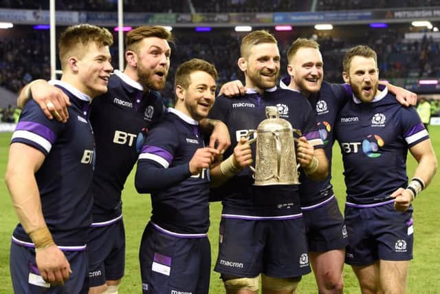 Huw Jones, Ryan Wilson, Greg Laidlaw, John Barclay, Stuart Hogg and Tommy Seymour celebrate with the Calcutta Cup. Picture: PA