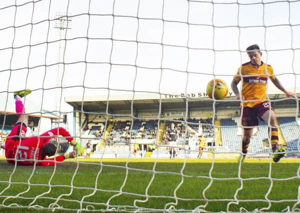 Motherwell's Craig Tanner pounces to score the only goal of the game. Picture: SNS