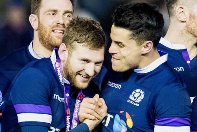 Finn Russell, left, and Sean Maitland celebrate at full time
