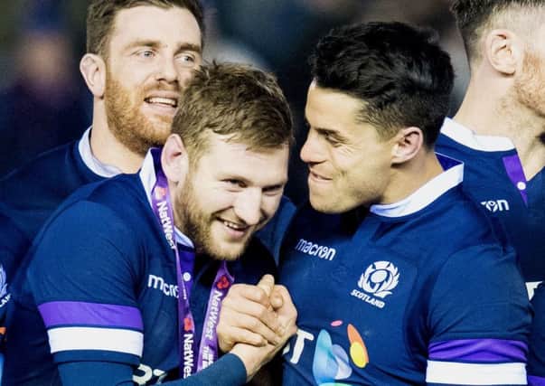 Finn Russell, left, and Sean Maitland celebrate at full time