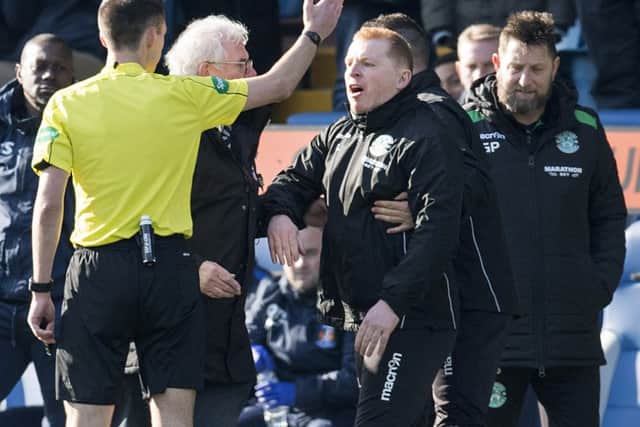 Hibernian manager Neil Lennon exchanges words with referee Kevin Clancy. Picture; SNS