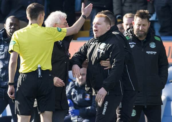 Hibernian manager Neil Lennon exchanges words with referee Kevin Clancy. Picture; SNS