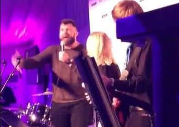 Alex Corbisiero on stage at Murrayfield