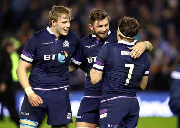 Ryan Wilson (centre) celebrates after the final whistle during the RBS Six Nations match at BT Murrayfield. Picture; PA