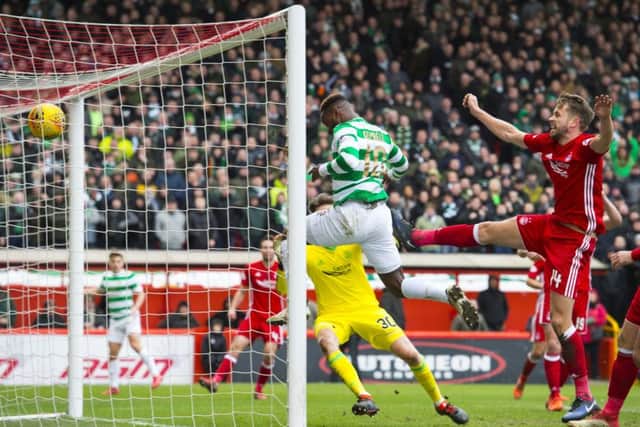 Moussa Dembele scores to give Celtic the lead against Aberdeen at Pittodrie. Picture: SNS.