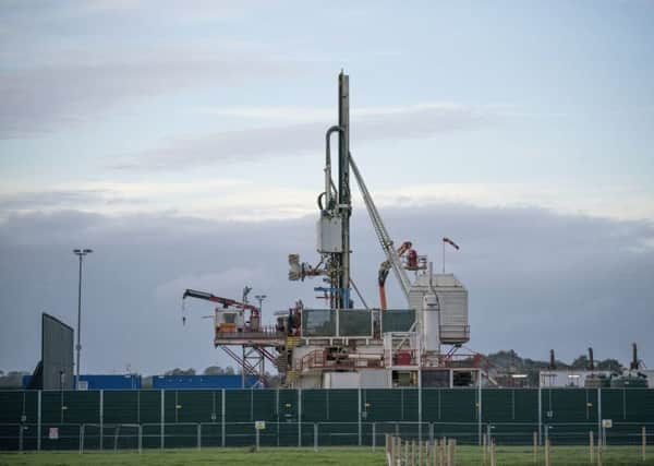 A shale gas fracking rig is set up by workers. (Picture: Getty)
