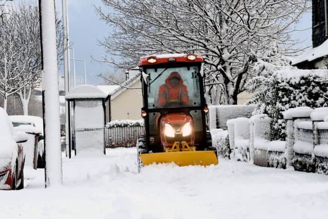 A mini gitter out clearing paths this morning in Armadale, West Lothian. Picture; Lisa Ferguson