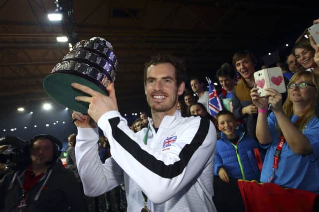 Andy Murray lifts the trophy following their victory during day three of the Davis Cup Final. He has added his signature to a list of stars who want fur banned after Brexit. Picture: Jordan Mansfield