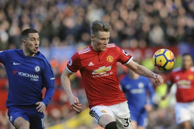Scott McTominay vies for the ball with Chelsea's Eden Hazard. Picture: AP