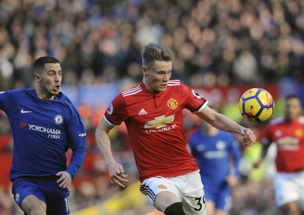 Scott McTominay vies for the ball with Chelsea's Eden Hazard. Picture: AP