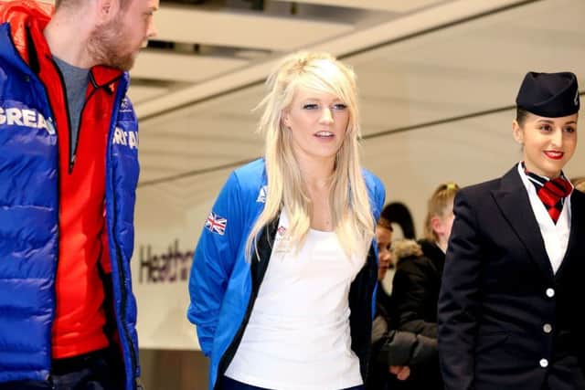 Elise Christie at Heathrow Airport sporting a protective boot. Picture: PA.