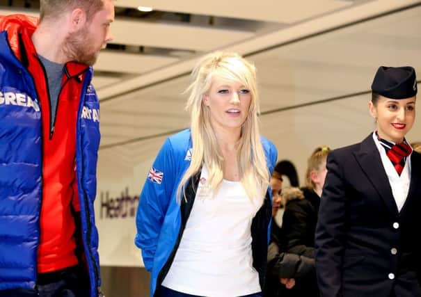 Elise Christie at Heathrow Airport sporting a protective boot. Picture: PA.