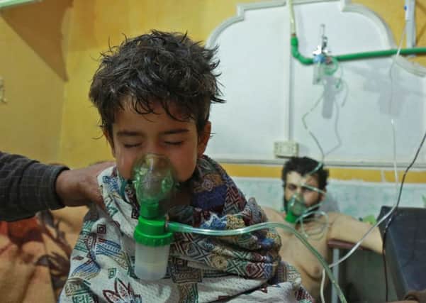 Children and adults are treated after a suspected chemical attack in eastern Ghouta, Syria. Picture: AFP/Getty